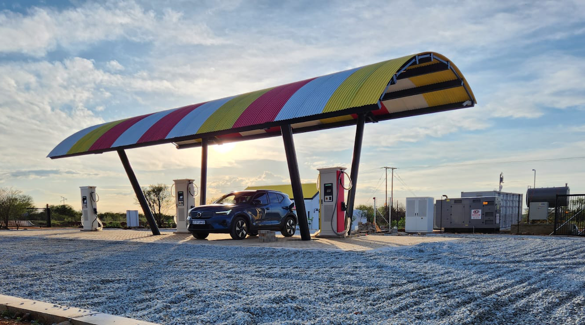Solar canopy EV charging station against an African sunset — off-grid and load-shedding-proof