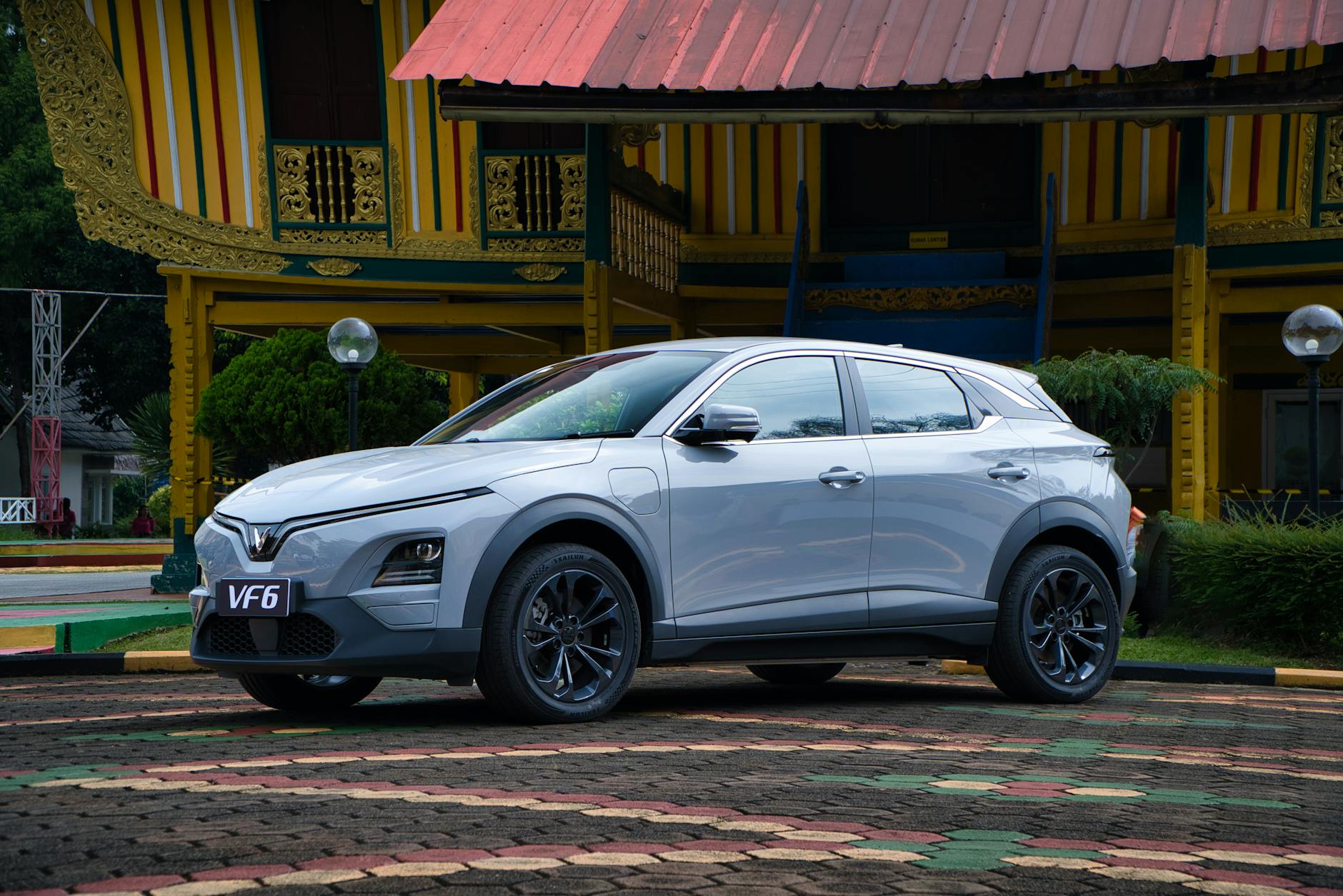 White Dongfeng VF6 electric SUV in front three-quarter view, showing compact crossover design with charging port and modern styling