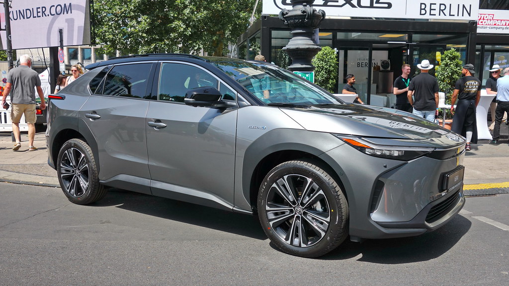 Side-by-side comparison of Toyota bZ4X electric SUV and Toyota RAV4 2.0 VX petrol SUV with pricing and range specifications f