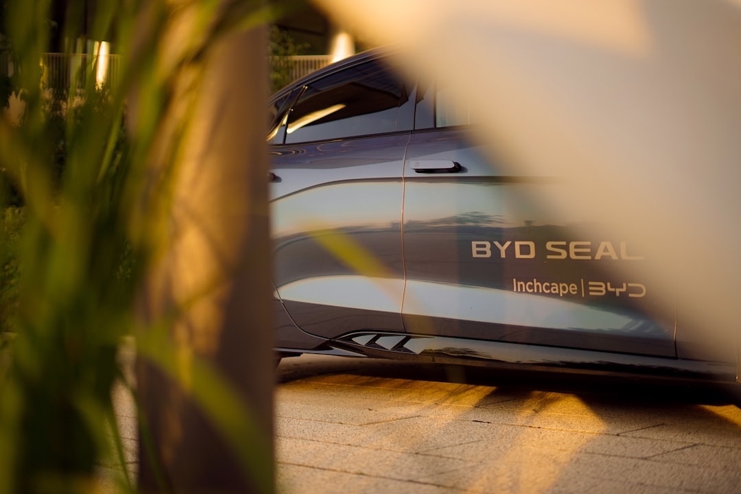 BYD Seal electric sedan in silver, side profile showing door badging and distinctive body character lines
