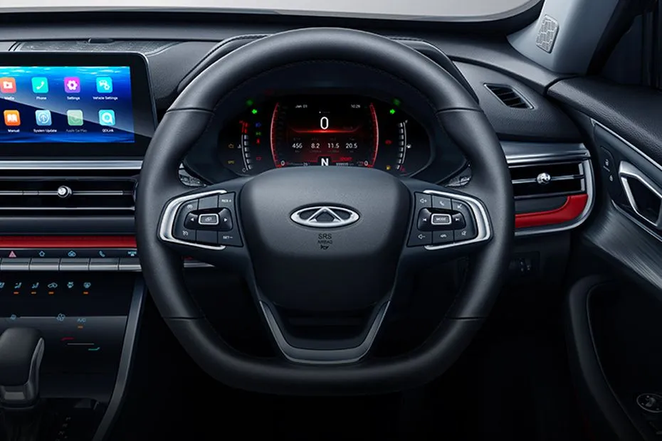 Chery Q interior showing black steering wheel, digital instrument cluster, and modern dashboard with touchscreen infotainment system